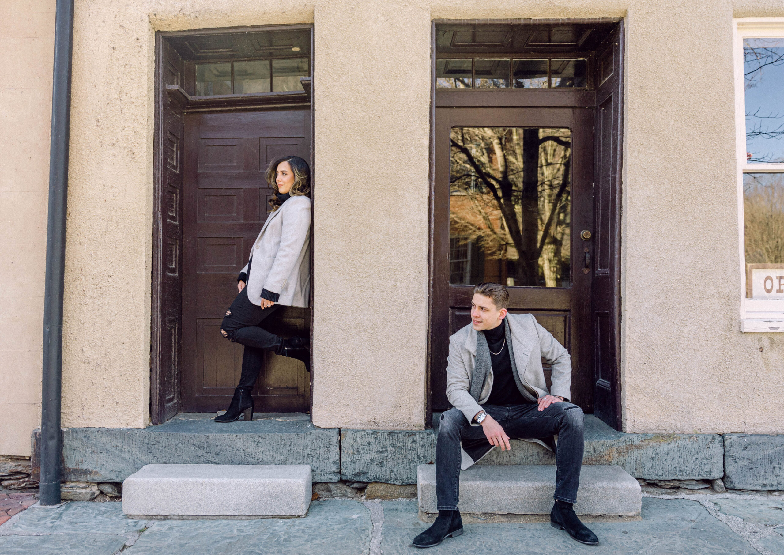 engaged-couple-posing-for-engagement-photos-in-harpers-ferry